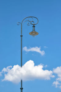 Low angle view of street light against clear blue sky