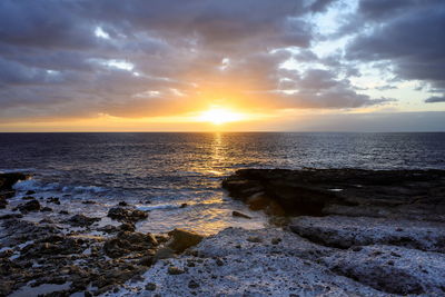 Scenic view of sea against sky during sunset