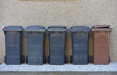 Trash cans against the wall