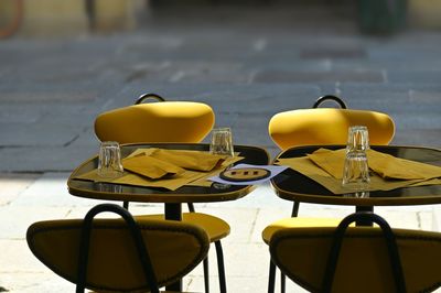 Empty chairs and tables in restaurant terrace