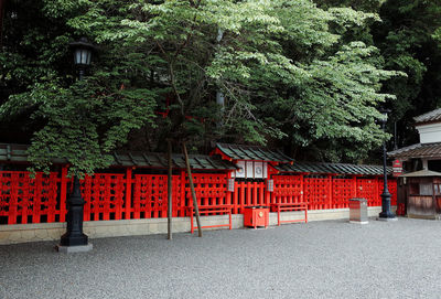 Red built structure against trees