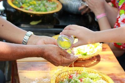 Close-up of people washing hands