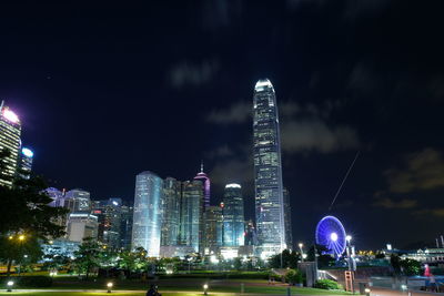 Illuminated city against sky at night