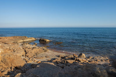 Scenic view of sea against clear sky