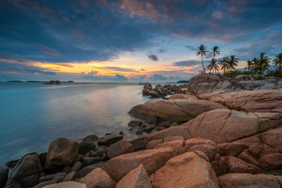 Scenic view of sea against sky at sunset