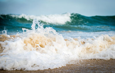 Close-up of waves splashing on shore