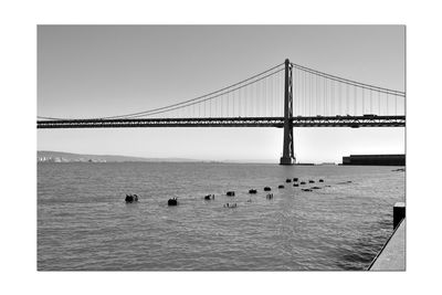 View of suspension bridge over sea