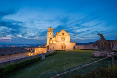 Historic building against blue sky at dusk