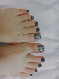 Close-up of foot with nail art