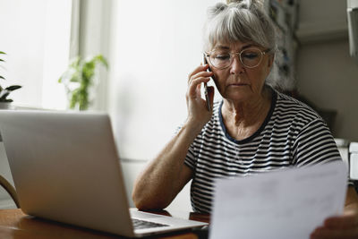 Senior woman using laptop