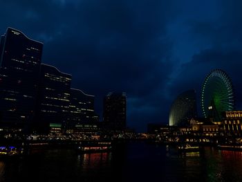 Illuminated buildings in city at night