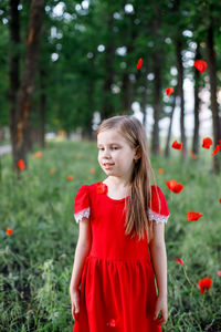 Girl standing on red land