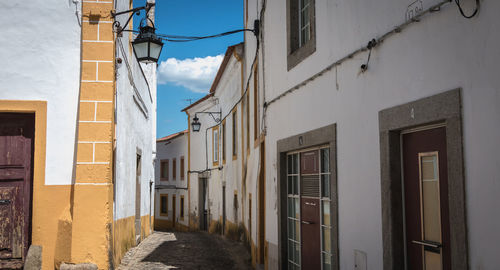 Narrow alley amidst buildings in city