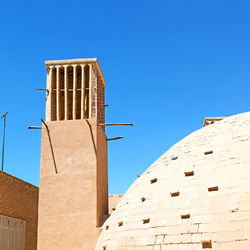 Low angle view of building against blue sky