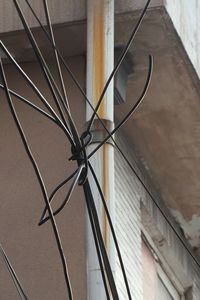 Low angle view of cables on wall