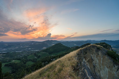 Scenic view of landscape against sky during sunset