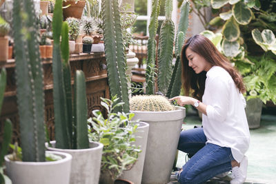 Woman standing by plants