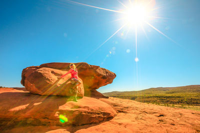 Rock formations in desert against blue sky