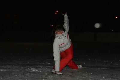 Full length of woman standing at night