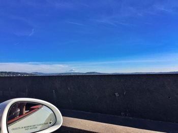 Cars on road against sky