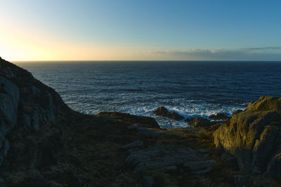 Scenic view of sea against sky during sunset