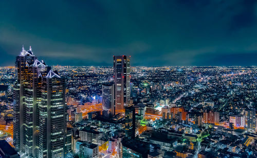 High angle view of illuminated buildings in city