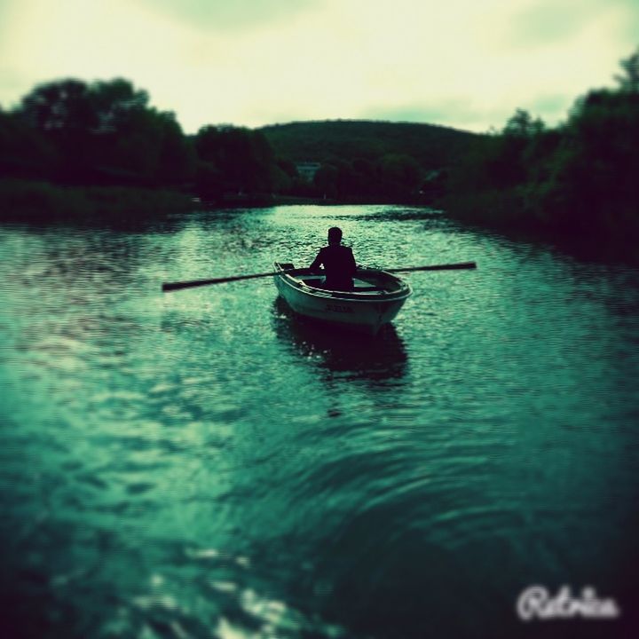 water, transportation, nautical vessel, mode of transport, boat, men, leisure activity, lifestyles, waterfront, lake, nature, travel, river, sailing, sitting, tranquility, reflection, sky