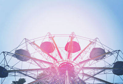 Low angle view of ferris wheel against clear sky