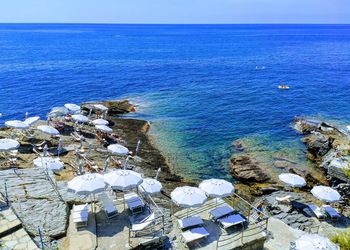 High angle view of sea shore against clear sky