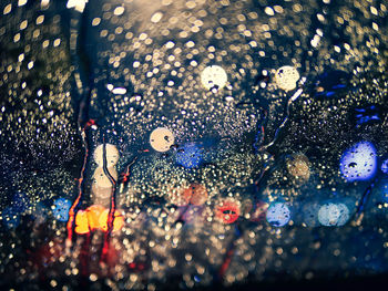 High angle view of raindrops on glass window