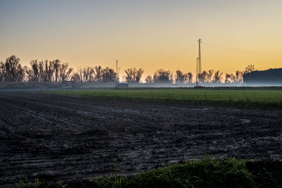 Scenic view of field against sky during sunset