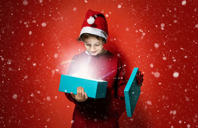 Portrait of a girl holding snow