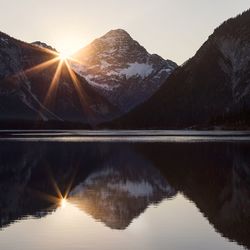 Scenic view of mountains against sky during sunset