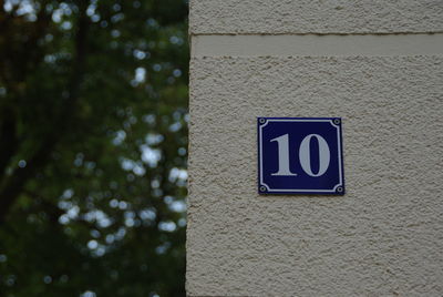 Low angle view of house number on wall