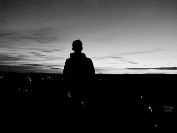 Silhouette man against sky during sunset