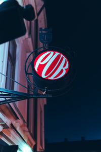 Low angle view of illuminated lighting equipment