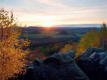 Scenic view of landscape against sky during sunset