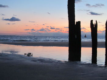 Scenic view of sea against sky at sunset