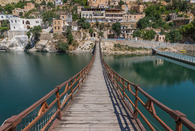 Footbridge over river in city