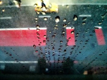 Close-up of rain drops on road