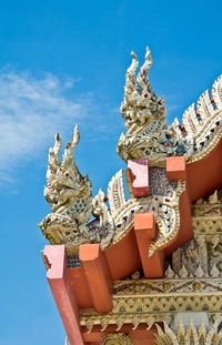 Detail of ornately decorated temple roof in thailand