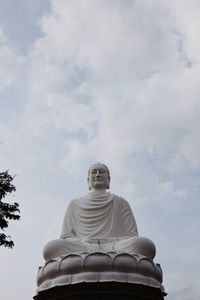 Low angle view of statue against sky