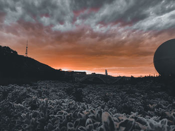 Surface level of rocks against sky during sunset