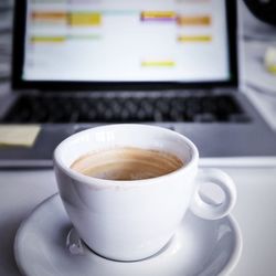 Close-up of coffee cup on table