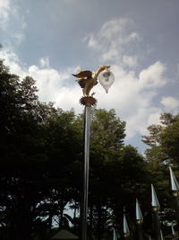 Low angle view of street light against sky