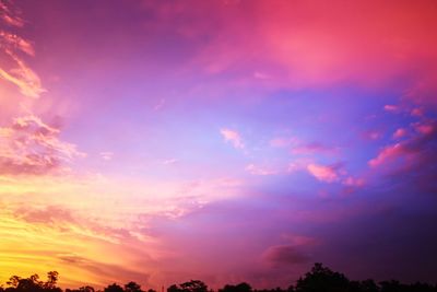 Low angle view of dramatic sky during sunset