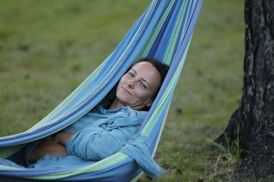 Portrait of man relaxing on hammock