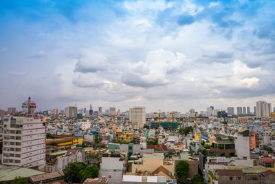 High angle view of buildings in city against sky