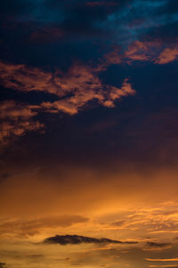 Low angle view of dramatic sky during sunset
