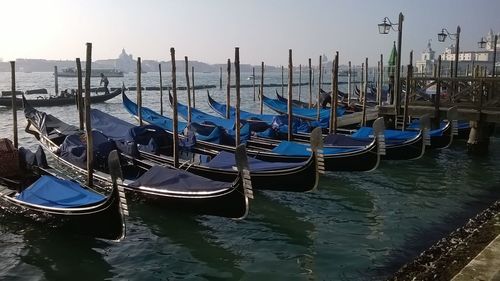 Boats moored in canal